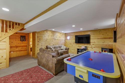 a living room with a pool table at 10-Acre Cabin, Sauna, Hot Tub, Game Rm, Stargazing Dome, EV, BBQ in Logan