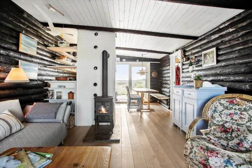 a living room with a wood stove in it at JB119-Brovst-Ejstrup-Strandvej-18 in Brovst