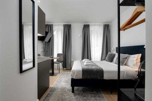 Ένα ή περισσότερα κρεβάτια σε δωμάτιο στο GuestReady - Greenwich Park Studios
