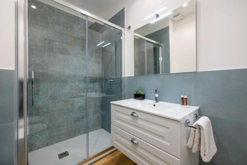 a bathroom with a sink and a shower at L'Altalena in Fiumicino