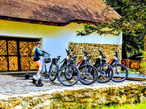 a person is standing next to a group of bikes at Nature rezidence private wellness in Zahorčice