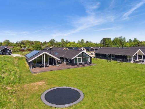an aerial view of a house with a large yard at Holiday Home Vara - 800m from the sea by Interhome in Vejby