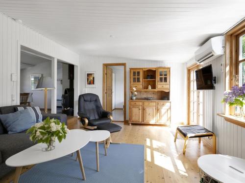 a living room with a couch and a table at Holiday Home Ilena - 16-3km from the sea by Interhome in Borup
