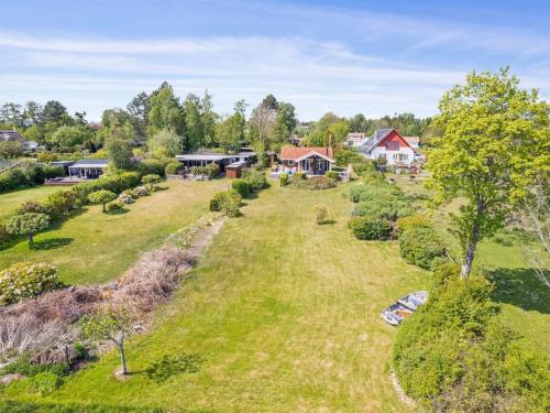 an aerial view of a yard with trees and houses at Holiday Home Brunman - 10m to the fjord by Interhome in Grevinge