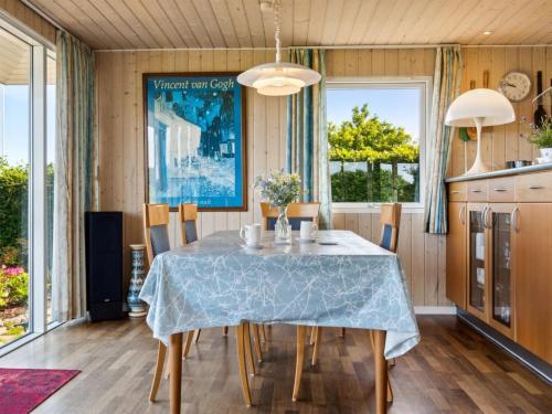 a dining room with a table and chairs at Holiday Home Eleana - 300m to the fjord by Interhome in Roskilde