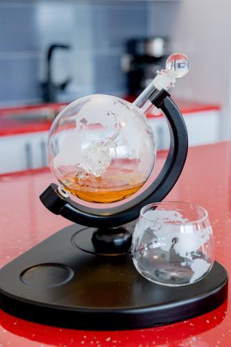 a glass bowl on a stand next to a cup at Home for 10 with Pool and Solar Panels in Caguas! in Caguas