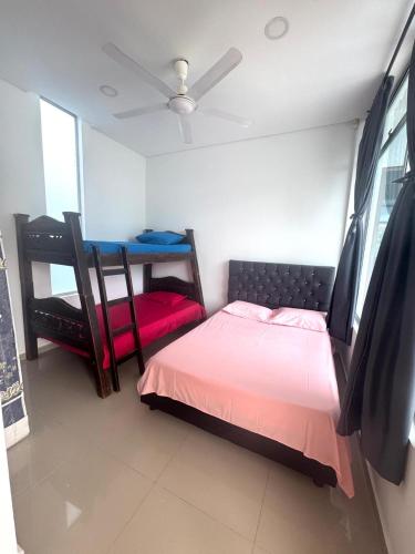 a bedroom with a bed and a table in it at Casa RE in Flandes