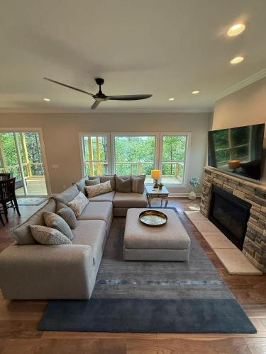 a living room with a couch and a fireplace at The Overlook at Lake James in Nebo