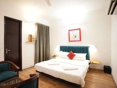 Ένα ή περισσότερα κρεβάτια σε δωμάτιο στο Hotel Rustam Residency