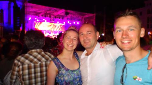three people posing for a picture at a party at Giorgi's Homestay in Kutaisi