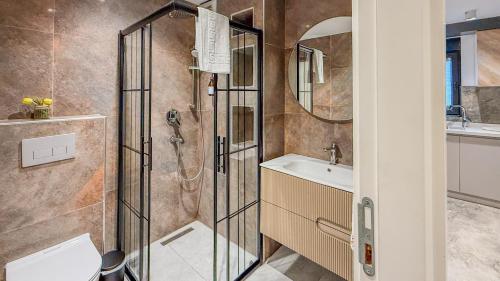 a bathroom with a shower and a sink at Leos Apartments Apart1 in Side
