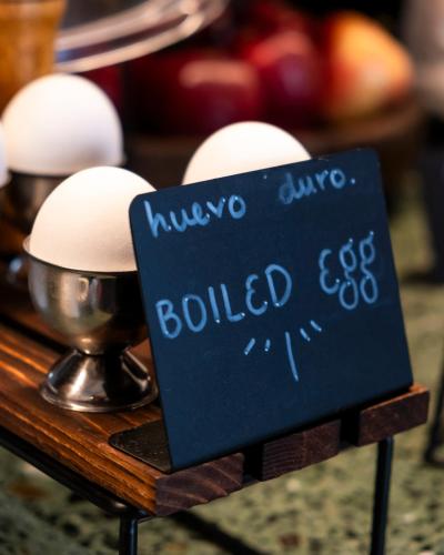 a sign on a table with eggs on it at Hotel Parián in Mexico City