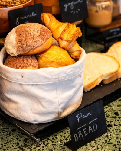 a basket of bread sitting on top of a table at Hotel Parián in Mexico City