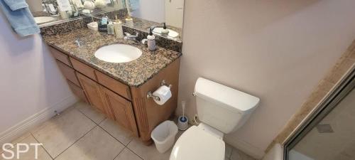 a bathroom with a sink and a toilet in it at Island Time #4 condo in South Padre Island