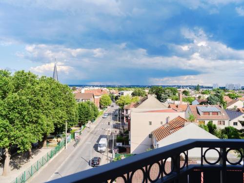 a view of a city from a balcony at Parisian Haven - Chic Penthouse near Paris & CDG in Le Blanc-Mesnil