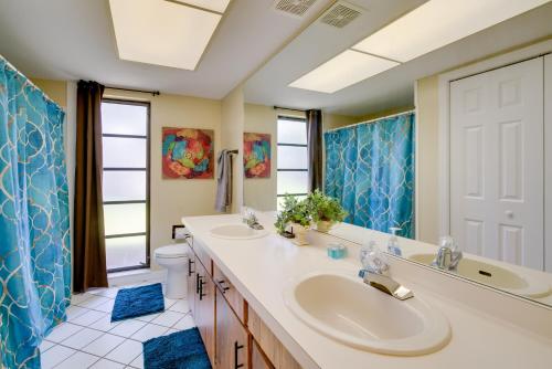 a bathroom with two sinks and a toilet at Walk to Lake Geataway with Yard in Inverness in Inverness