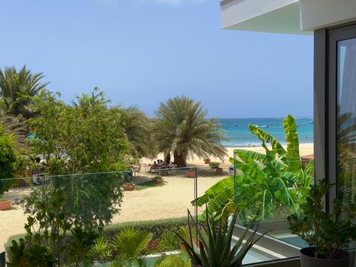 a view of the beach from the window of a house at Penthouse Panoramic Ocean Views - By Bobbywashere in Santa Maria