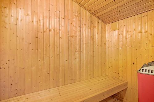 a wooden sauna with a bench in it at JB179-Fjerritslev-Slojbrovej-77 in Gøttrup