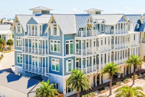 an aerial view of a large blue and white building with palm trees at Coastal Reverie TC 6301 in Mustang Beach