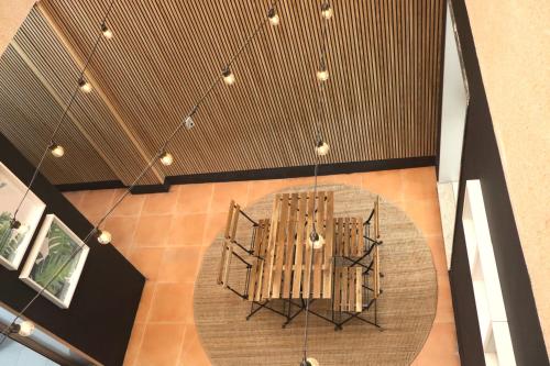 an overhead view of a table and chairs in a room at Casa do Balneario in Arnoia