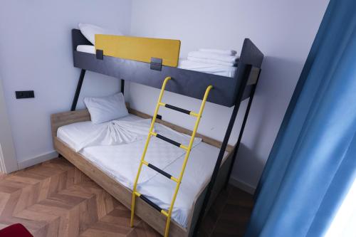 a bunk bed with a ladder in a room at Forest In Hotel in Kemer