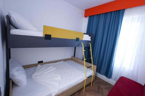 a small room with a bunk bed and a window at Forest In Hotel in Kemer