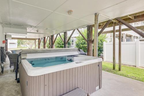 a hot tub in the middle of a patio at Unique A-Frame Beach House The Beacon at OIB in Ocean Isle Beach