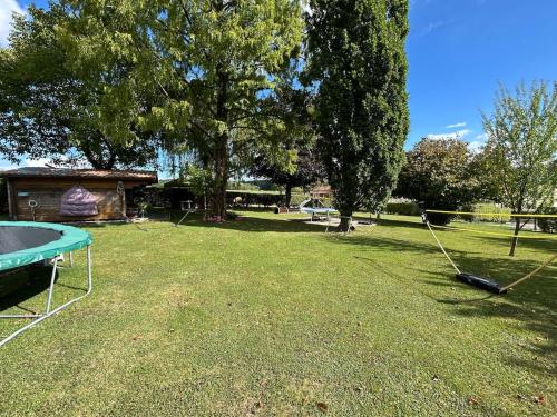 a park with a ping pong table in the grass at Geyershof Country Retreat 