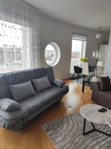 a living room with a couch and a table at Wilde Guest Apartment Tigutorn in Tartu