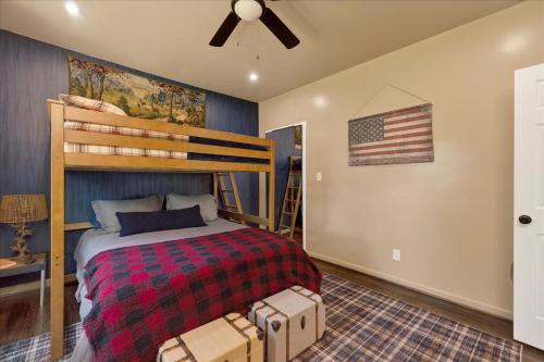 a bedroom with a bed and an american flag at #TheLakeHouse - Fun, Fishing & Games - Near Airport,BJCC,Downtown,Crossplex in Birmingham