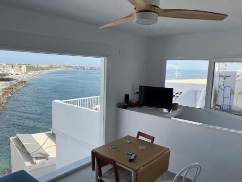 a living room with a view of the ocean at Villa Balcony of La Caleta in Salobreña