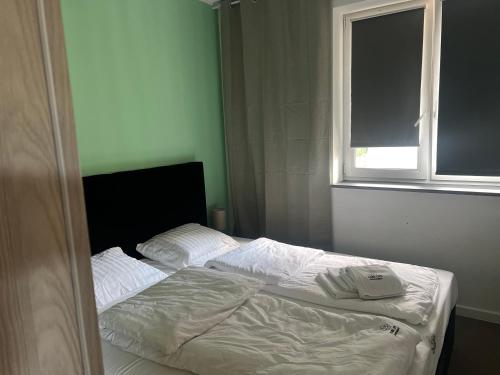 Ένα ή περισσότερα κρεβάτια σε δωμάτιο στο Duży Apartament 3 pokoje Park City