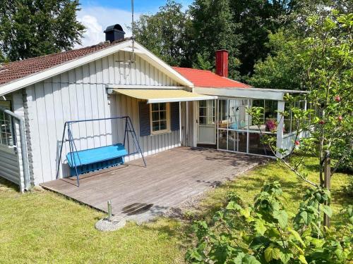 a house with a wooden deck in front of it at KAL570-Fagerhult-Solaeng-419 in Fagerhult