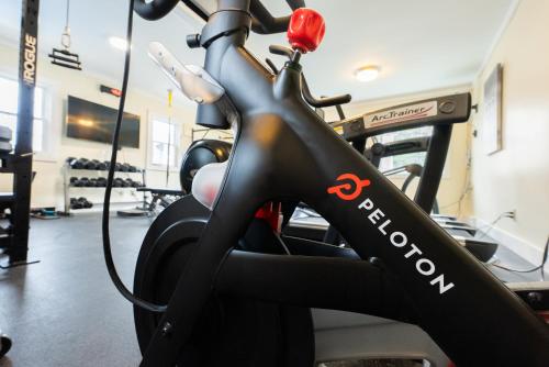 a gym with a bike in a room at Aspinquid Resort in Ogunquit