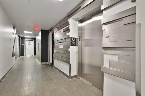 a hallway of an office with walk in closets at The Columbus Haven-Near OSU & Downtown in Fawcett Center For Tomorrow Heliport