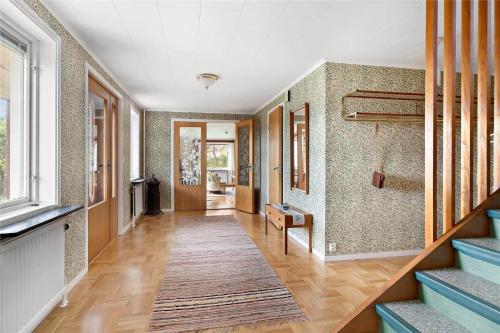 a hallway of a home with a staircase and a room at KAL430-Loenneberga-Katebo-4 in Ingelstorp