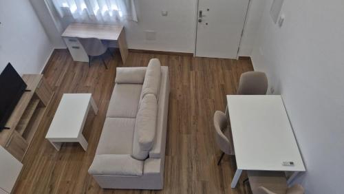 a living room with a couch and a table at Reding Loft in Bailén