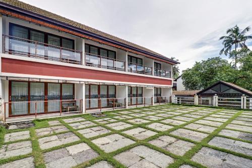 an empty courtyard in front of a building at OAK Edassery's Sealine Villa Stay in Cochin