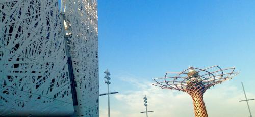a tall building with a sculpture in front of it at Hotel Forum in Baranzate
