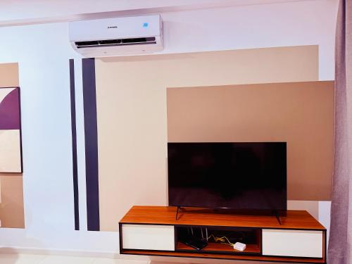 a living room with a flat screen tv at Majestic Residence Klcc in Kuala Lumpur