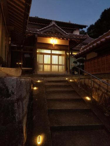a set of steps leading to a building with lights at Inari 808 - Vacation STAY 20185 in Yasugi