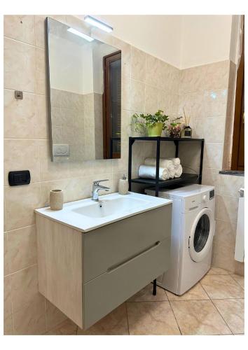 a bathroom with a washing machine and a sink at Garden Home "Milan-Rho fair" in Solaro