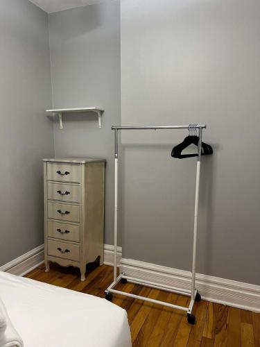 a bedroom with a bed and a dresser in a room at South Loop 3 Bedroom Apt in Chicago