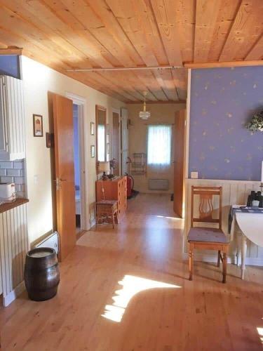 a large living room with a wooden ceiling and wooden floors at VGO715-Hova-Hulan-Strandvaegen-9 in Vallsjöbol