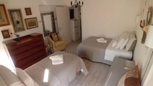 a bedroom with a bed and a table and a mirror at Casa Riad in Lesmo