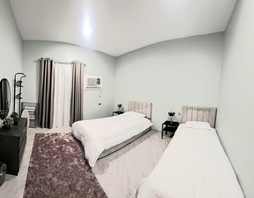 Postel nebo postele na pokoji v ubytování Lavender Apartment