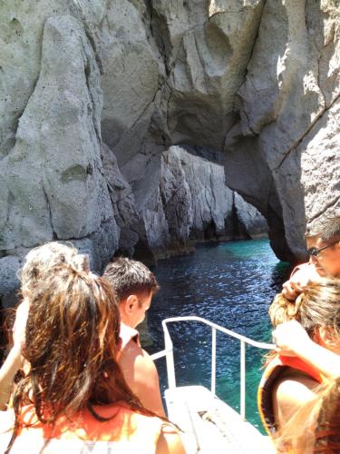 a group of people on a boat in a cave at Hotel Hacienda Bugambilias in La Paz