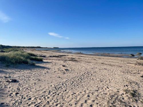 a sandy beach with the ocean in the background at SKA733-Bastad-Stalhoegavaegen-144 in Grevie