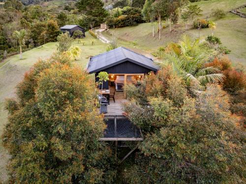 an overhead view of a house with a wooden deck at Retreat Villas Llanogrande By CHX in Rionegro