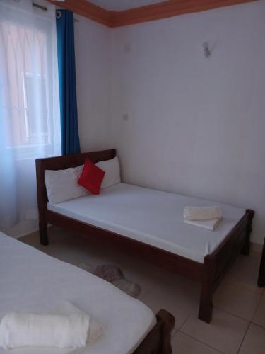Katil atau katil-katil dalam bilik di Mtwapa Luxury Residence 101